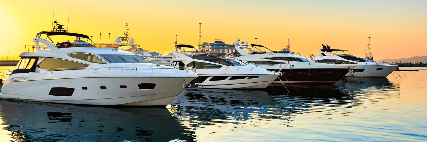 Yachts on calm water in golden evening light